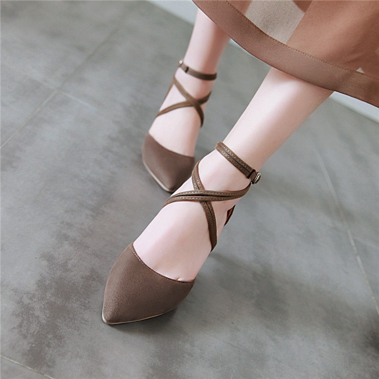 Women's stiletto closed toe shoe with brass buckle