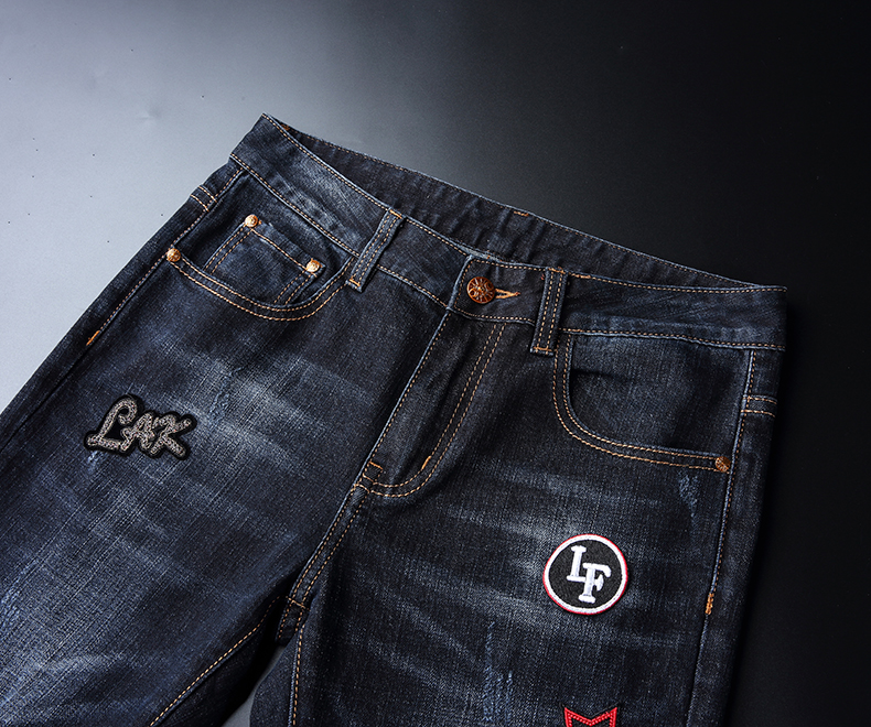 Dark Denim Jeans with logo patches and front pockets